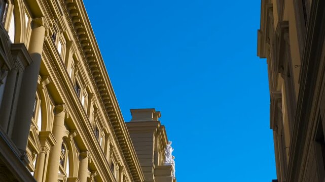 Palazzo delle poste centrali in florence revealing under blue sky. Majestic palazzo delle poste centrali in florence gradually reveals itself under a vibrant blue sky, showcasing architectural details