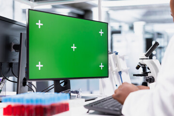 Isolated mockup screen next to scientist that works for research study, using lab equipment and biochemistry tools near desktop pc. Healthcare data analysis and genetics research for discovery.