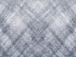 Abstract symmetrical pattern of white and gray speckled texture design
