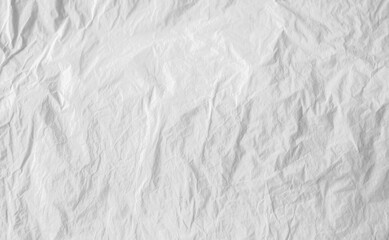Close up of a crumpled white paper showing texture and subtle shadows