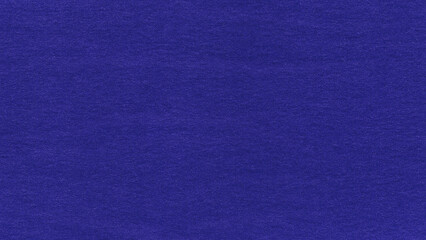 A deep cobalt blue texture suggests a quiet strength and a touch of mystery in its uniform expanse. Smooth and uniform intense blue fabric texture