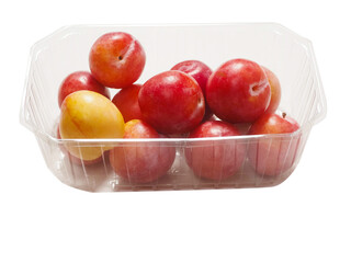 Fresh pure nectarine with glossy skin in a plastic basket on white background. Agriculture product ready to eat and for sale. Food chain supply. Clean ripe organic product carefully selected.
