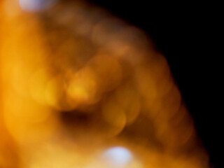 Colorful light leaks on black background for design and special effects. Retro film look. Abstract colorful light beams.