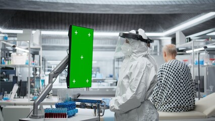 Vertical isolated mockup next to doctor treating patient with severe infection in hazmat suit, using laboratory testing and diagnostic tools to study disease and prevent global disaster. Camera A.