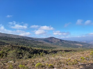 Panoramic View of Mountain Highlands Under Bright Blue Sky