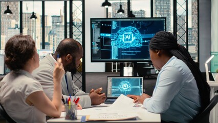 Recruiters reviewing feedback from artificial intelligence platform, using automation and deep...