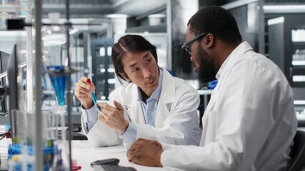 Analytical chemists using scientific gear in research facility used for complex experiments. Clinical microbiologists in high tech laboratory doing genetics research using lab equipment - Powered by Adobe