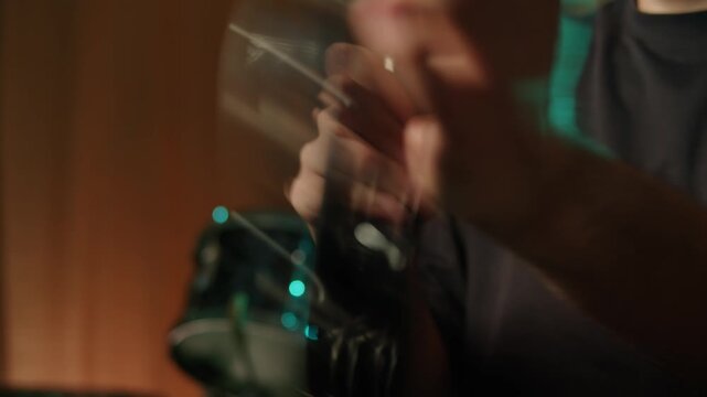 Musical instrument, tambourine Percussion, man playing in studio, sound and creativity. Plastic tambourine in a mans hand.