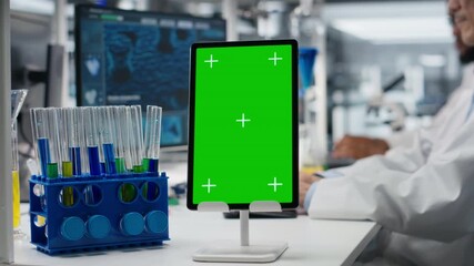 Lab engineer using isolated screen tablet for DNA data analysis, supporting clinical research. Asian scientist studying genomics information for human health study using chroma key device, camera B - Powered by Adobe