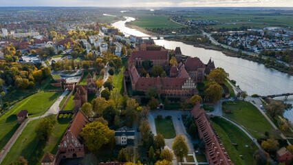 Aerial late afternoon view of Malbork Castle by the Nogat River