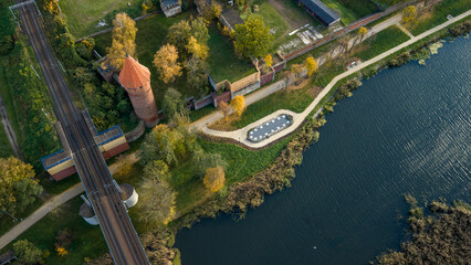 Aerial late afternoon view of Malbork Castle by the Nogat River, Poland