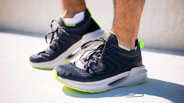 New athletic shoes showcased on a person during an outdoor activity event