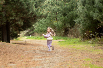Joyful child running in nature's forest pathway. Nature