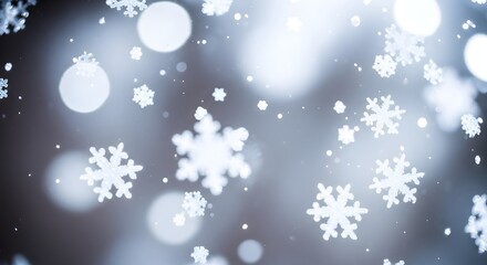 Fototapeta premium Abstract winter background featuring shimmering white snowflakes and soft bokeh lights.