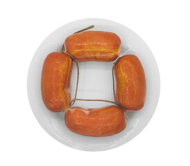 smoked frankfurter sausages on white plate