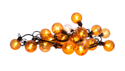 Orange and clear round string lights with black wire are piled together on a white background, cutout