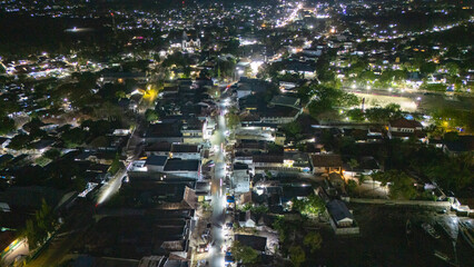 The atmosphere of Waingapu's Old Town to the Seaport seen from the air with a drone at night