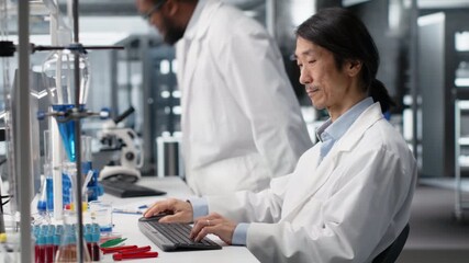 Laboratory scientist looking for genomic variation in genetic markers using PC. Jolly man identifying DNA mutations, mapping genomics analysis using program on computer, camera B - Powered by Adobe