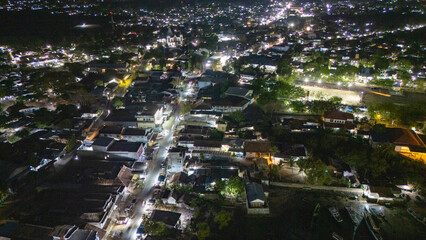 The atmosphere of Waingapu's Old Town to the Seaport seen from the air with a drone at night
