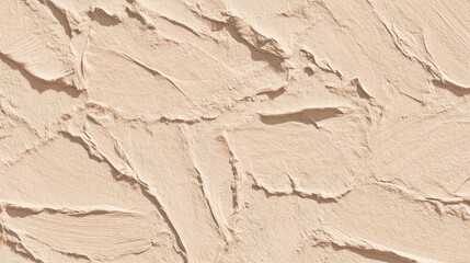 Fototapeta premium Close-up of textured, beige, rough surface with raised, curved strokes creating light & shadow play. It appears as if the wall is plastered