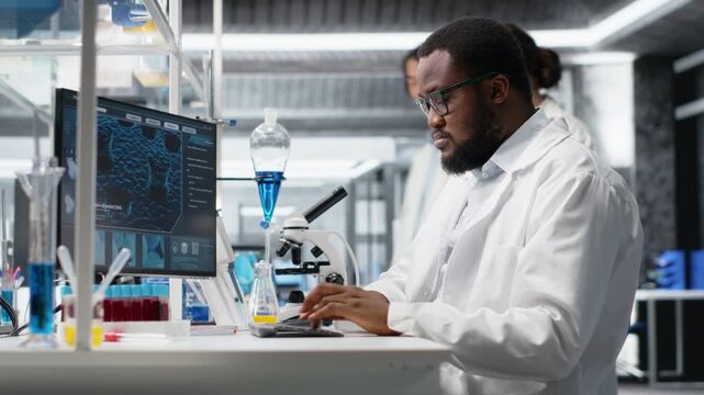 Laboratory scientist squinting eyes at computer monitor, processing DNA patient data, thinking. Lab specialist looking at genetic analysis diagnostics, brainstorming scientific breakthroughs, camera B