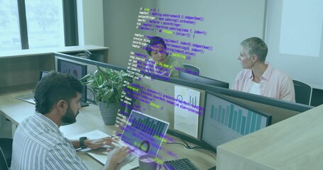 Typing Indian developer tapping laptop keyboard in office, with monitors, coffee cup, mouse, plant © vectorfusionart