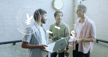 Colleagues discussing finances in loft landing, with laptop, mug, smartphone and currency signs