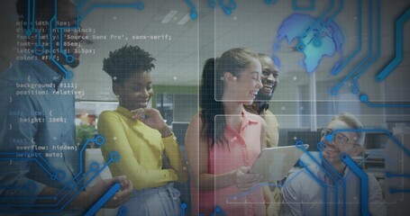 Collaborating team reviewing project on tablet in open-plan office, with laptop and smartphone