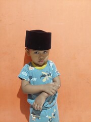 Expression of a 2 year old boy who is happy