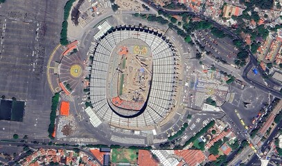 Aerial view of Azteca Stadium in Mexico City surrounded by urban landscape