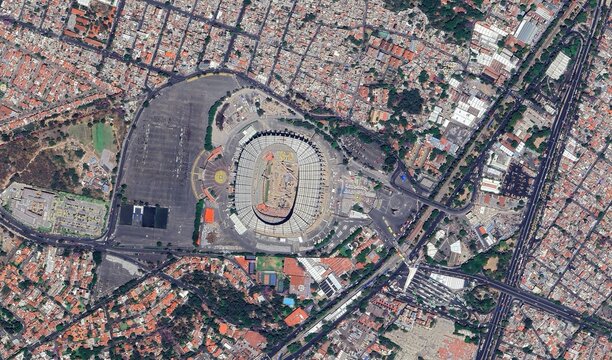 Aerial view of Azteca Stadium in Mexico City surrounded by urban landscape