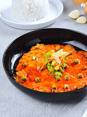 Indonesian Spicy Omelette with Red Sauce and Steamed Rice on Black Plate – Traditional Asian Cuisine Food Photography