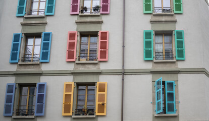 Fototapeta premium Geneva, Switzerland - October 12, 2025: Part of building with colourful shutters.