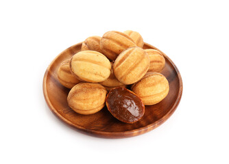 Delicious nut shaped cookies with boiled condensed milk isolated on white