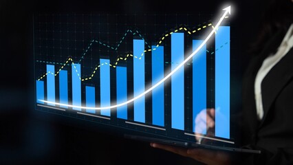 A digital display featuring bar graphs and a line chart illustrating business growth projections. Ideal for financial analysis and strategic planning presentations. Copula