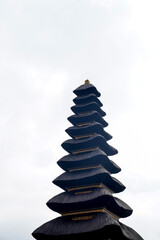 Ulun Danu Beratan Temple, a magnificent floating Hindu temple on Lake Beratan, Bedugul, Bali, Indonesia, with clear cloudy skies