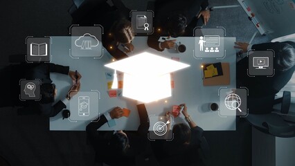 A team of professionals engaged in a strategic meeting around a conference table, with technology and education symbolism enhancing the collaborative environment. Raster