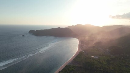 Scenic waves at Mawun Beach, Lombok Island, Indonesia — tropical bay with blue water and gentle surf, popular spot for surfing and relaxation