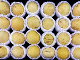 Fresh Asian Pears in Protective Packaging Ready for Market, Offering Sweetness and Juicy...