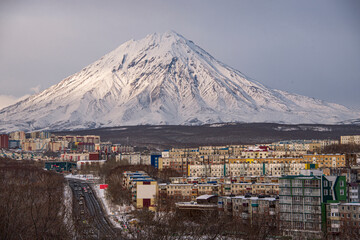 There is Petropavlovsk-Kamchatskyi on the foreground. There is Koryakskyi volcano on the background.