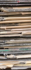 Stacked corrugated cardboard weathered edges textured