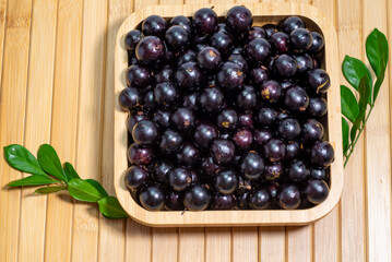 A bowl full of  fresh 'jabuticabas'