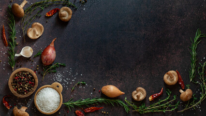 Top down view of various healthy herbs and foods used to add flavour to a dish. 