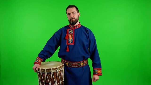Man in Traditional Sami Clothing Holds Drum on Isolated Green Screen Background Northern European Indigenous People Featuring