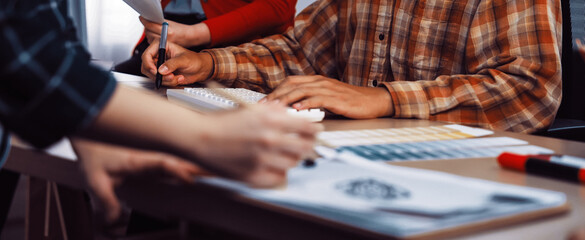 A diverse group of people collaborates in a modern office space, sharing ideas during a...