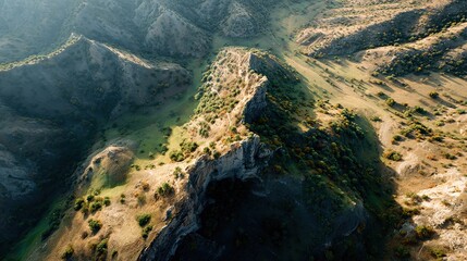 An aerial drone view captures rugged mountain slopes covered in sparse vegetation and dramatic shadows showcasing textured geological formations