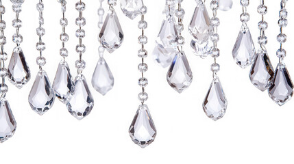 Close up of hanging crystal chandelier pendants on strings against a black background studio shot
