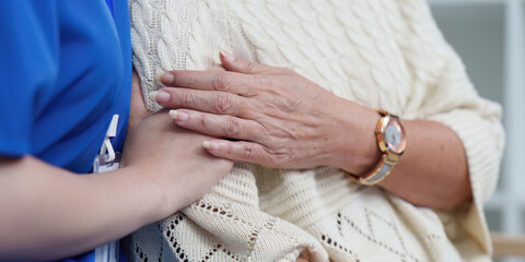 Healthcare. Compassionate nurse providing emotional support to elderly patient.