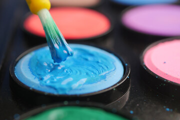 Engaging in vibrant painting with colors and brush technique