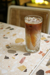Refreshing iced drink on a sunny cafe table